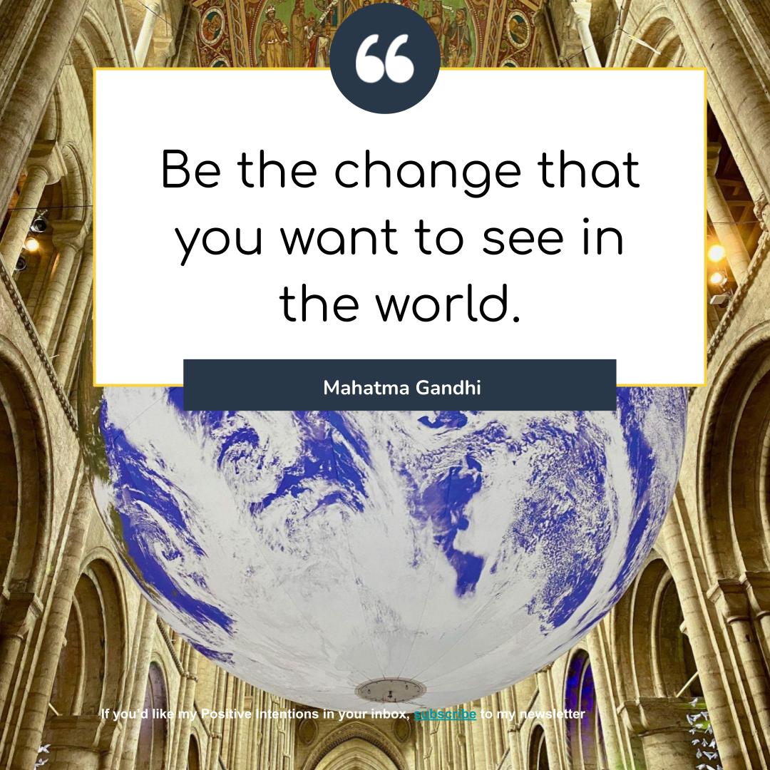 Photo of globe suspended from the ceiling of Ely cathedral. Image taken by Liz Gooster. Gandhi quote about being the change you want to see superimposed on image.
